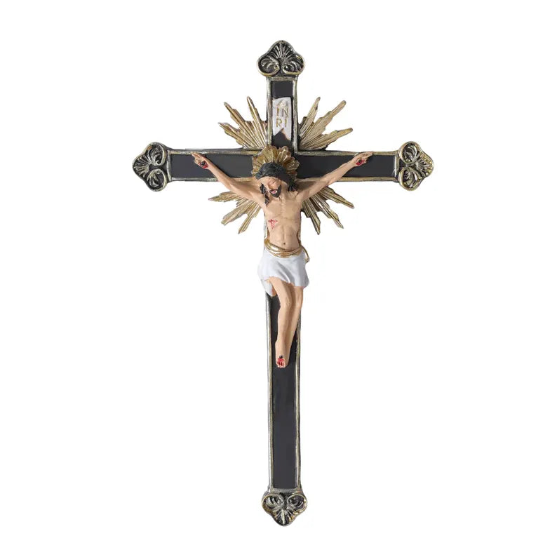 ornate black and gold wall crucifix statue white background