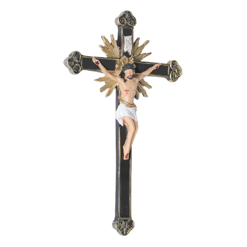 ornate black and gold wall crucifix statue white background