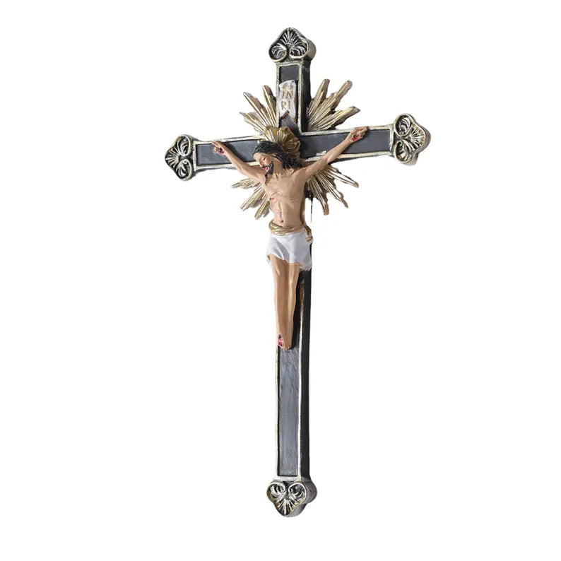 ornate black and gold wall crucifix statue white background